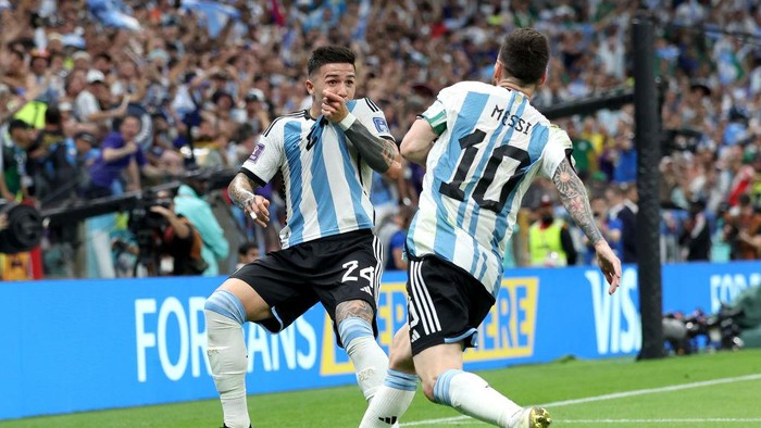 LUSAIL CITY, QATAR - NOVEMBER 26: Enzo Fernandez of Argentina celebrates with teammate Lionel Messi after scoring their teams second goal  during the FIFA World Cup Qatar 2022 Group C match between Argentina and Mexico at Lusail Stadium on November 26, 2022 in Lusail City, Qatar. (Photo by Maja Hitij - FIFA/FIFA via Getty Images)