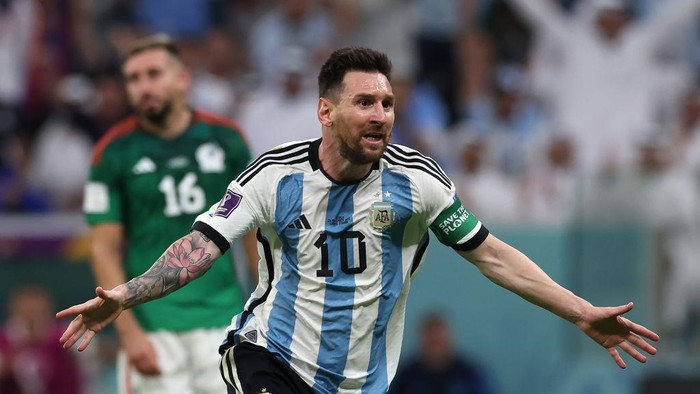 LUSAIL CITY, QATAR - NOVEMBER 26: Enzo Fernandez of Argentina celebrates with teammate Lionel Messi after scoring their teams second goal  during the FIFA World Cup Qatar 2022 Group C match between Argentina and Mexico at Lusail Stadium on November 26, 2022 in Lusail City, Qatar. (Photo by Maja Hitij - FIFA/FIFA via Getty Images)