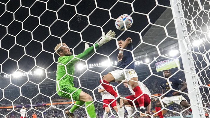Frances Kylian Mbappe scores his sides second goal during the World Cup group D soccer match between France and Denmark, at the Stadium 974 in Doha, Qatar, Saturday, Nov. 26, 2022. (AP Photo/Martin Meissner)