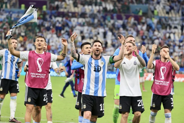 LUSAIL CITY, QATAR - NOVEMBER 26: Lionel Messi (10) of Argentina celebrates with his teammates after winning the FIFA World Cup Qatar 2022 Group C match between Argentina and Mexico at Lusail Stadium on November 26, 2022 in Lusail City, Qatar. (Photo by Mohammed Dabbous/Anadolu Agency via Getty Images)