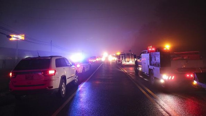 MARYLAND, UNITED STATES - NOVEMBER 28: Search and rescue workers and firefighters conduct operation after a small plane crashed into Transmission Tower in Maryland, United States on November 28, 2022. The crash caused widespread power outages in Montgomery County. (Photo by Celal Gunes/Anadolu Agency via Getty Images)