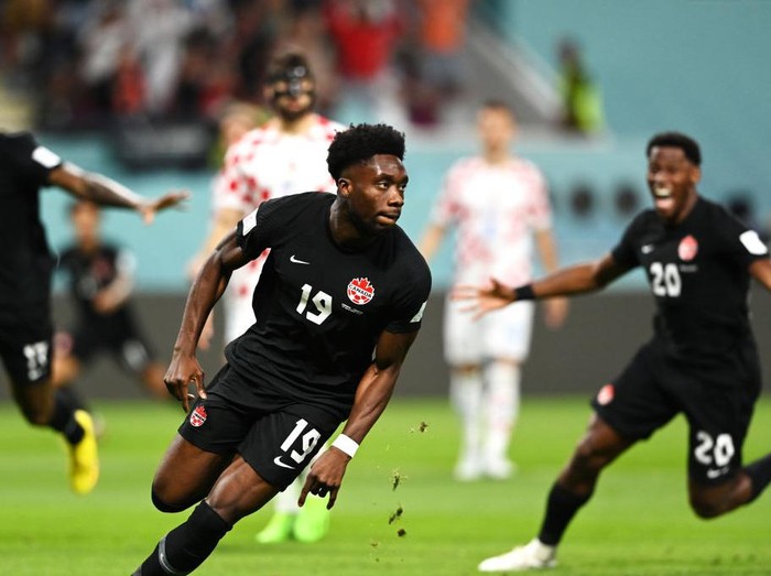 DOHA, QATAR - NOVEMBER 27: Alphonso Davies of Canada celebrates after scoring their team's first goal during the FIFA World Cup Qatar 2022 Group F match between Croatia and Canada at Khalifa International Stadium on November 27, 2022 in Doha, Qatar. (Photo by Claudio Villa/Getty Images)