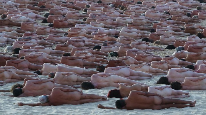 SYDNEY, AUSTRALIA - NOVEMBER 26: (EDITORS NOTE: Image contains nudity.) Members of the public pose at sunrise for photographic artist Spencer Tunick at Bondi Beach on November 26, 2022 in Sydney, Australia. US artist and photographer Spencer Tunick created the nude installation using thousands of volunteers posing at sunrise on Bondi Beach, commissioned by charity Skin Check Champions to raise awareness of skin cancer and to coincide with National Skin Cancer Action Week. (Photo by Lisa Maree Williams/Getty Images)