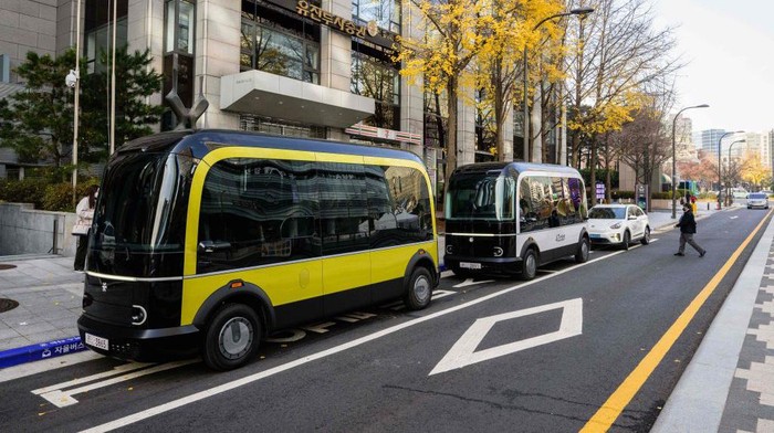 In this photo taken in Seoul on November 23, 2022, a bus leaves its stop on the country's first self-driving bus route run by 42 Dot, a start-up owned by South Korea's Hyundai which created the automomous driving technology. - South Korea's capital launched its first self-driving bus route on November 25, part of an experiment which engineers said aims to make the public feel more comfortable with driverless vehicles on the roads. (Photo by Anthony WALLACE / AFP) (Photo by ANTHONY WALLACE/AFP via Getty Images)