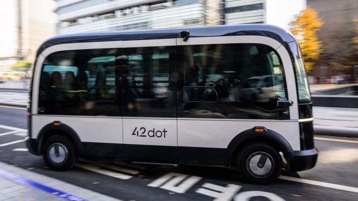 In this photo taken in Seoul on November 23, 2022, a bus leaves its stop on the countrys first self-driving bus route run by 42 Dot, a start-up owned by South Koreas Hyundai which created the automomous driving technology. - South Koreas capital launched its first self-driving bus route on November 25, part of an experiment which engineers said aims to make the public feel more comfortable with driverless vehicles on the roads. (Photo by Anthony WALLACE / AFP) (Photo by ANTHONY WALLACE/AFP via Getty Images)