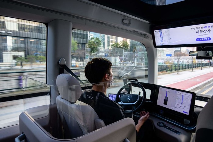 In this photo taken in Seoul on November 23, 2022, a bus leaves its stop on the countrys first self-driving bus route run by 42 Dot, a start-up owned by South Koreas Hyundai which created the automomous driving technology. - South Koreas capital launched its first self-driving bus route on November 25, part of an experiment which engineers said aims to make the public feel more comfortable with driverless vehicles on the roads. (Photo by Anthony WALLACE / AFP) (Photo by ANTHONY WALLACE/AFP via Getty Images)