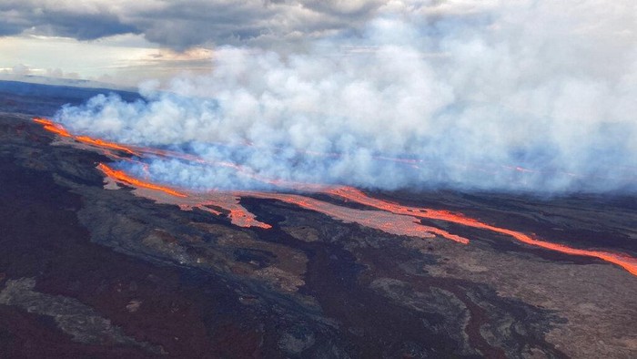 In this aerial photo released by the U.S. Geological Survey, the Mauna Loa volcano is seen erupting from vents on the Northeast Rift Zone on the Big Island of Hawaii, Monday, Nov. 28, 2022. Hawaii's Mauna Loa, the world's largest active volcano, began spewing ash and debris from its summit, prompting civil defense officials to warn residents on Monday to prepare in case the eruption causes lava to flow toward communities. (U.S. Geological Survey via AP)
