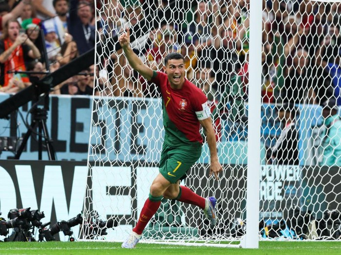 LUSAIL CITY, QATAR - NOVEMBER 28: Cristiano Ronaldo #7 of Portugal celebrates his team's first goal by team mate Bruno Fernandes #8 during the FIFA World Cup Qatar 2022 Group H match between Portugal v Uruguay at Al Janoub Stadium on November 28, 2022 in Lusail City, Qatar. (Photo by Liu Lu/VCG via Getty Images)