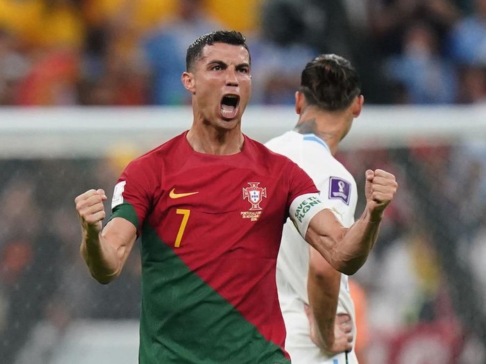Portugal's Cristiano Ronaldo celebrates after team-mate Bruno Fernandes scores their side's first goal of the game during the FIFA World Cup Group H match at the Lusail Stadium in Lusail, Qatar. Picture date: Monday November 28, 2022. (Photo by Adam Davy/PA Images via Getty Images)