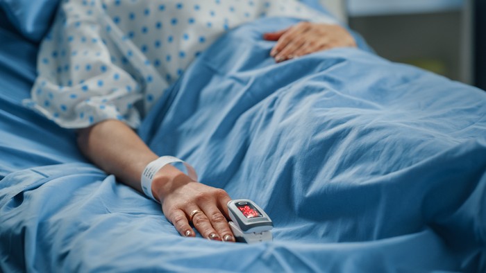 Hospital Ward: Portrait of Beautiful Young Woman Sleeping in Bed, Fully Recovering after Sickness. Female Patient Dreaming About Her Happy Healthy Future.