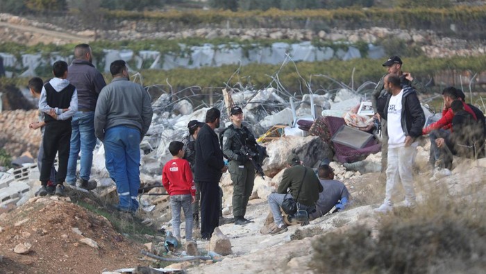 HEBRON, WEST BANK - NOVEMBER 28: Heavy duty machines of Israeli forces demolish a Palestinian family's house allegedly for being unauthorized in Hebron, West Bank on November 28, 2022. (Photo by Mamoun Wazwaz/Anadolu Agency via Getty Images)