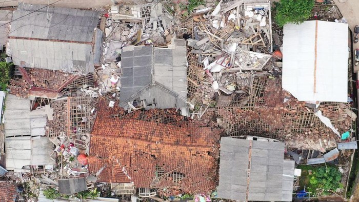An aerial view shows damaged and collapsed houses in Cugenang, Cianjur on November 23, 2022, following a 5.6-magnitude earthquake on November 21. - Survivors of an Indonesian earthquake that killed at least 268 people appealed for food and water on November 23 as rescuers picked through devastated villages, with hopes fading of finding anyone alive. (Photo by ADEK BERRY / AFP) (Photo by ADEK BERRY/AFP via Getty Images)