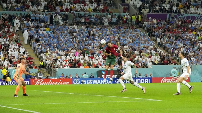 Portugals Cristiano Ronaldo scores his sides opening goal during the World Cup group H soccer match between Portugal and Uruguay, at the Lusail Stadium in Lusail, Qatar, Monday, Nov. 28, 2022. (AP Photo/Themba Hadebe)