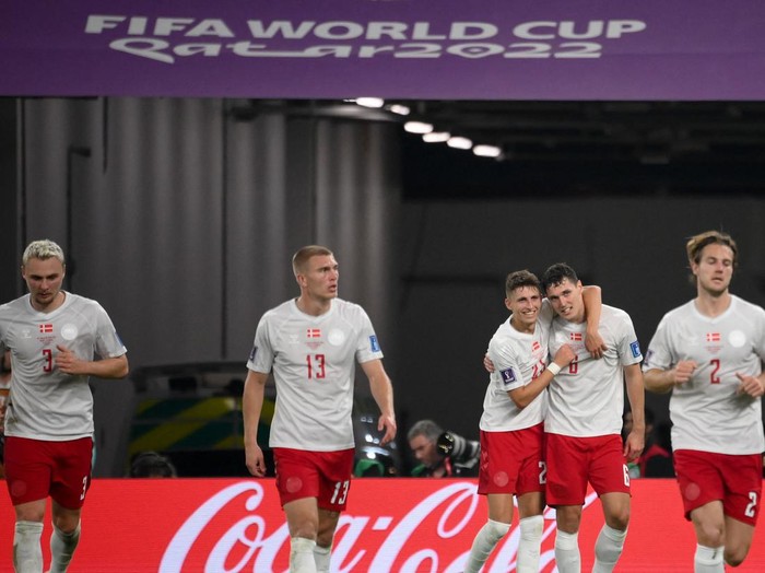Denmarks defender #06 Andreas Christensen (2nd-R) celebrates with teammates after scoring his teams first goal during the Qatar 2022 World Cup Group D football match between France and Denmark at Stadium 974 in Doha on November 26, 2022. (Photo by FRANCK FIFE / AFP) (Photo by FRANCK FIFE/AFP via Getty Images)
