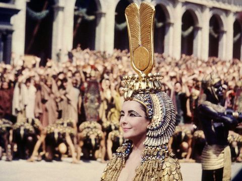 British-born American actress Elizabeth Taylor (1932 - 2011) winking in the title role of 'Cleopatra', directed by Joseph L Mankiewicz, 1963. (Photo by Silver Screen Collection/Getty Images)