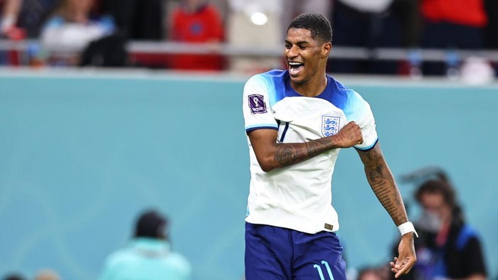 DOHA, QATAR - NOVEMBER 29: Marcus Rashford of England celebrates after scoring a goal to make it 3-0 during the FIFA World Cup Qatar 2022 Group B match between Wales and England at Ahmad Bin Ali Stadium on November 29, 2022 in Doha, Qatar. (Photo by Robbie Jay Barratt - AMA/Getty Images)