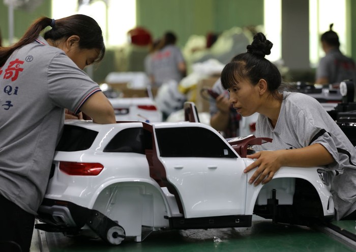 XINGTAI, CHINA - JULY 19: Employees assemble an electric toy car at a factory on July 19, 2022 in Xingtai, Hebei Province of China. (Photo by Wang Lei/VCG via Getty Images)