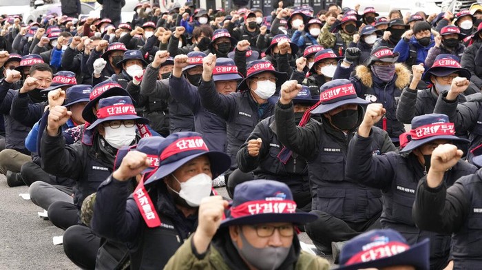 Members of the Cargo Truckers Solidarity union stage a rally against the government's return-to-work order on cement truckers in Uiwang, South Korea, Tuesday, Nov. 29, 2022. South Korea's government issued an order Tuesday for some of the thousands of truck drivers who have been on strike to return to work, insisting that their nationwide walkout over freight fare issues is hurting an already weak economy. (AP Photo/Ahn Young-joon)