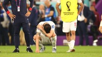 Pemain Iran bereaksi setelah pertandingan Grup B Piala Dunia FIFA Qatar 2022 antara Iran vs AS di Stadion Al Thumama di Doha, Qatar, Rabu (30/11) dini hari WIB. Evrim Aydin/Anadolu Agency/Getty Images