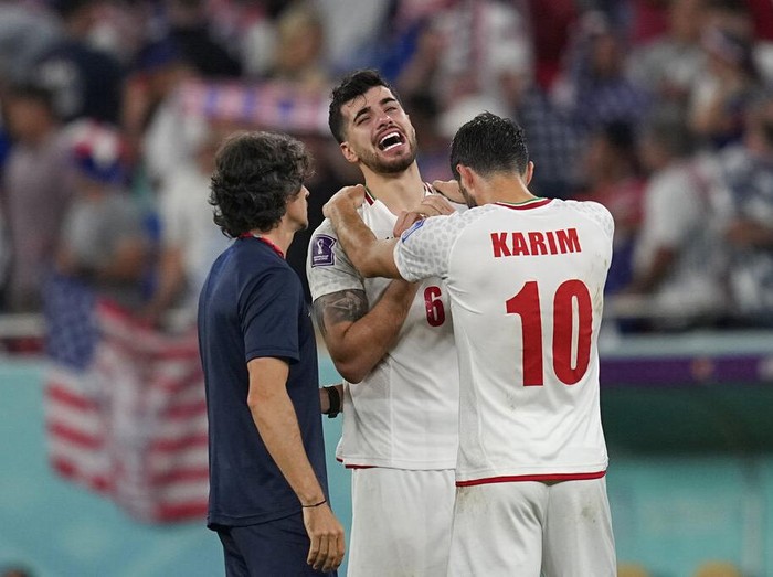 Iran's Saeid Ezatolahi cries at the end of the World Cup group B soccer match between Iran and the United States at the Al Thumama Stadium in Doha, Qatar, Wednesday, Nov. 30, 2022. (AP Photo/Ebrahim Noroozi)