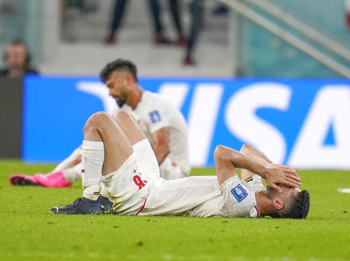 Iran's Ali Karimi is dejected after the World Cup group B soccer match between Iran and the United States at the Al Thumama Stadium in Doha, Qatar, Wednesday, Nov. 30, 2022. (AP Photo/Ricardo Mazalan)