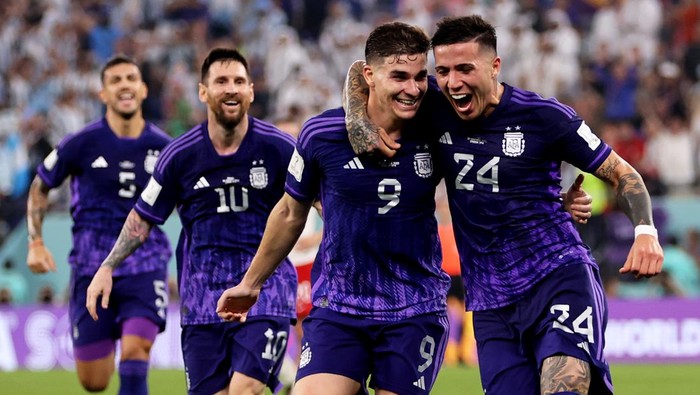 DOHA, QATAR - NOVEMBER 30: Julian Alvarez of Argentina (9) celebrates after scoring their teams second goal with Enzo Fernandez of Argentina during the FIFA World Cup Qatar 2022 Group C match between Poland and Argentina at Stadium 974 on November 30, 2022 in Doha, Qatar. (Photo by Clive Brunskill/Getty Images)