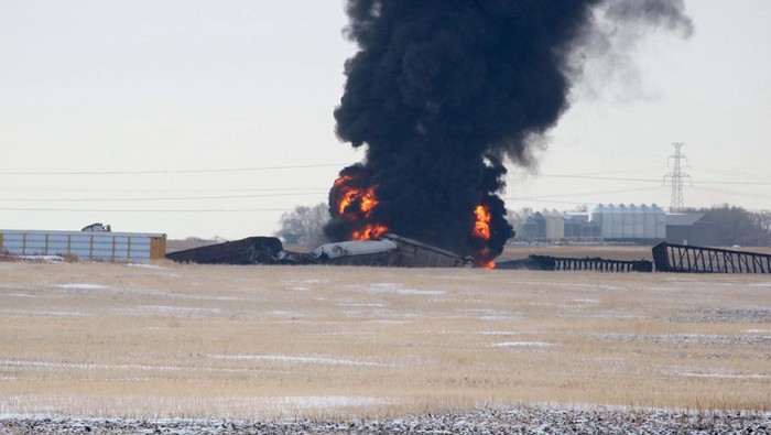 A view shows flames and smoke after a train derailment in Macoun, Saskatchewan, Canada, December 1, 2022, in this picture obtained from social media. David Grass/via REUTERS  THIS IMAGE HAS BEEN SUPPLIED BY A THIRD PARTY. MANDATORY CREDIT. NO RESALES. NO ARCHIVES.