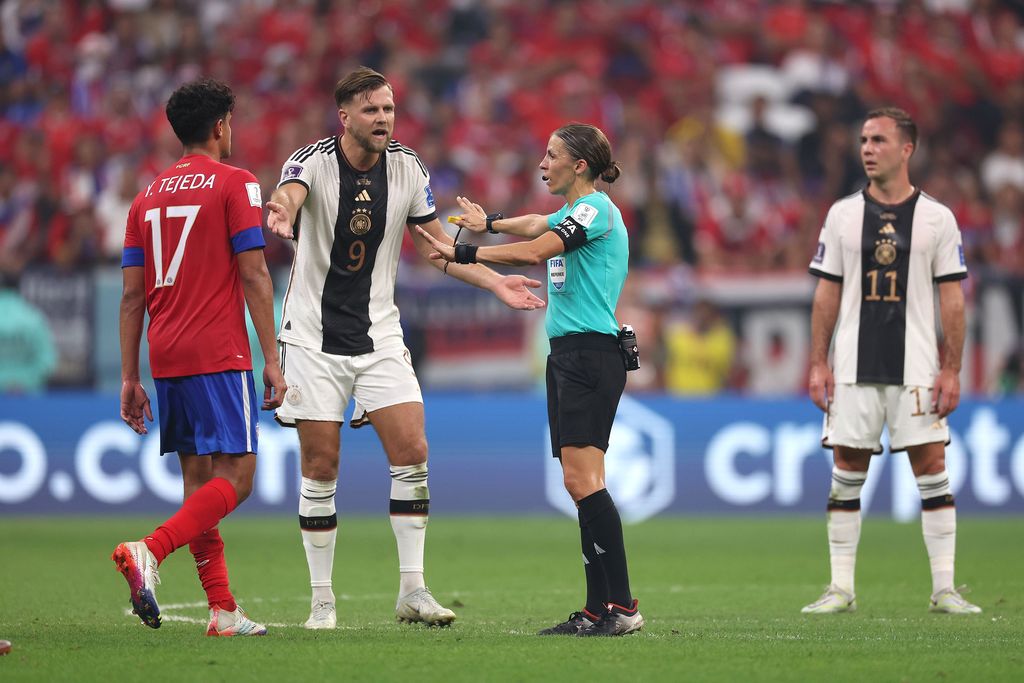 AL KHOR, QATAR - DECEMBER 01: Referee Stephanie Frappart reacts with Niclas Füllkrug of Germany before awarding Germany their fourth goal after a VAR check during the FIFA World Cup Qatar 2022 Group E match between Costa Rica and Germany at Al Bayt Stadium on December 01, 2022 in Al Khor, Qatar. (Photo by Alexander Hassenstein/Getty Images)