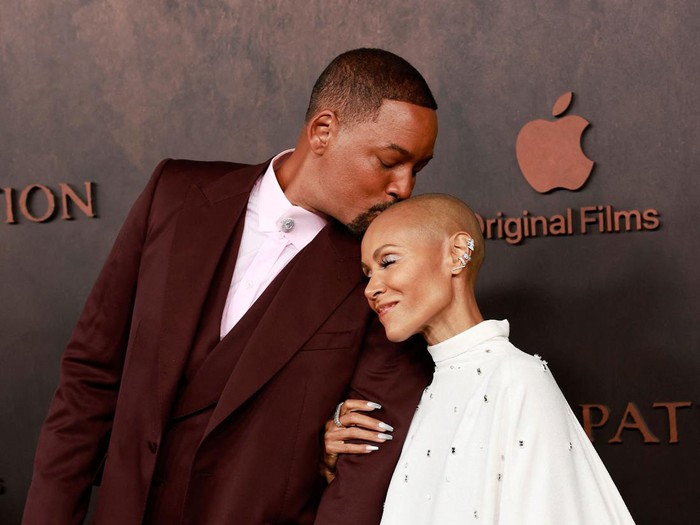 US actor Will Smith and his wife actress Jada Pinkett Smith arrive for the premiere of Apple Original Films Emancipation at the Regency Village Theatre in Westwood, California, on November 30, 2022. (Photo by Michael Tran / AFP) (Photo by MICHAEL TRAN/AFP via Getty Images)