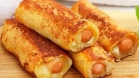 Roti gurih ini pasti disukai si kecil. Ada paduan sosis dan keju di dalamnya. Melahapnya juga mengenyangkan lho! Ayo buat pakai resep ini. Foto: iStock 