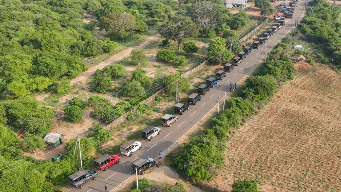 Foreign tourists going on a jungle safari in Yala National Park on November 30, 2022.  Yala National Park is the most visited and second-largest national park in Sri Lanka, bordering the Indian Ocean. This park is located at a distance of 309 km from the main city of Colombo. (Photo by Thilina Kaluthotage/NurPhoto via Getty Images)