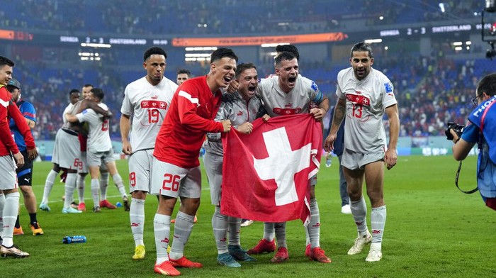 Switzerlands players celebrate at the end of the World Cup group G soccer match between Serbia and Switzerland, in Doha, Qatar, Friday Dec. 2, 2022. (AP Photo/Ricardo Mazalan)