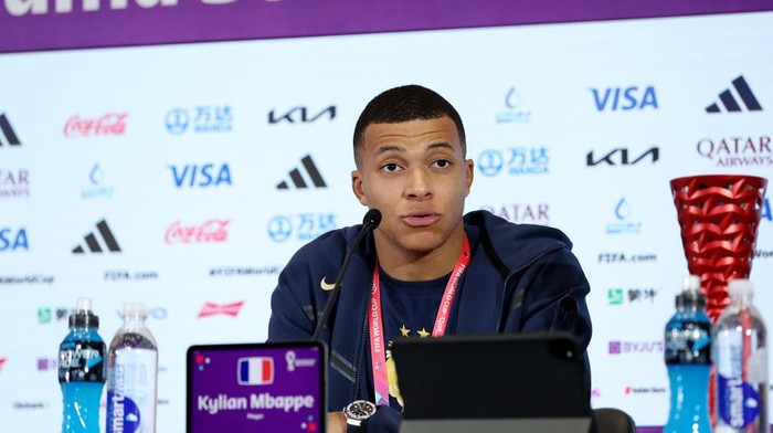 DOHA, QATAR - DECEMBER 04: Kylian Mbappe of France speaks to the media in the post match press conference after the team's victory during the FIFA World Cup Qatar 2022 Round of 16 match between France and Poland at Al Thumama Stadium on December 04, 2022 in Doha, Qatar. (Photo by Maja Hitij - FIFA/FIFA via Getty Images)