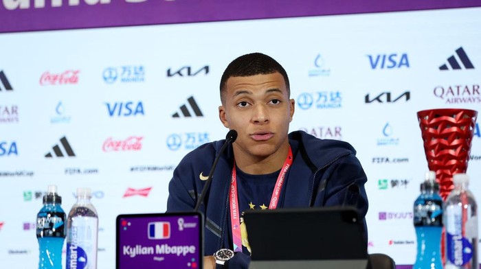 Kylian Mbappe DOHA, QATAR - DECEMBER 04: Kylian Mbappe of France speaks to the media in the post match press conference after the team's victory during the FIFA World Cup Qatar 2022 Round of 16 match between France and Poland at Al Thumama Stadium on December 04, 2022 in Doha, Qatar. (Photo by Maja Hitij - FIFA/FIFA via Getty Images)