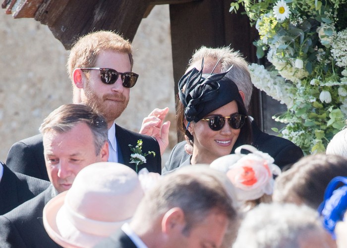 Prince Harry and Meghan FRENSHAM, UNITED KINGDOM - AUGUST 04: Prince Harry, Duke of Sussex and Meghan, Duchess of Sussex attend the wedding of Charlie Van Straubenzee on August 4, 2018 in Frensham, United Kingdom. Prince Harry attended the same prep school as Charlie van Straubenzee and have been good friends ever since. (Photo by Samir Hussein/Samir Hussein/WireImage)