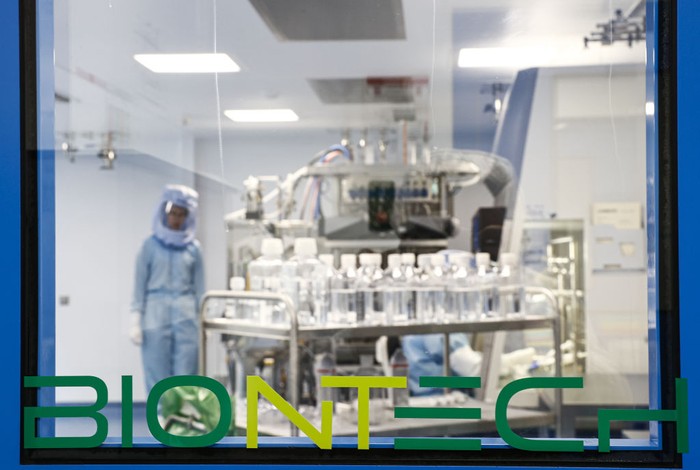MARBURG, GERMANY - MARCH 29: Employees in special suits test the procedures for the manufacturing of the messenger RNA (mRNA) for the Covid-19 vaccine in German company BioNTech, in Marburg, Germany on March 29, 2021. BioNTech Marburg's coronavirus vaccine production target will be 2.5 billion doses for 2021, up from 2.3 billion as it is considered as one of the largest manufacturing facilities producing mRNA vaccines in the world. The Pfizer-BioNTech vaccine was developed by Ozlem Tureci and Ugur Sahin, a couple who are children of Turkish immigrants in Germany. (Photo by Abdulhamid Hosbas/Anadolu Agency via Getty Images)