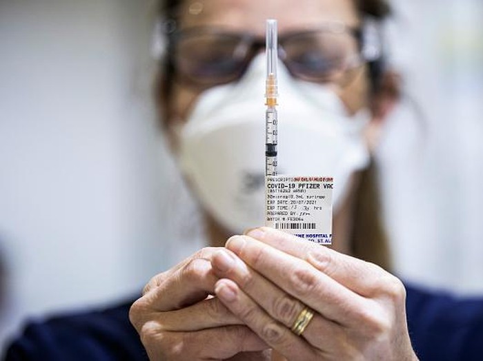 MELBOURNE, AUSTRALIA - JULY 20: Staff are seen preparing Pfizer vaccine doses inside the Melbourne Showgrounds COVID-19 Vaccination Centre on July 20, 2021 in Melbourne, Australia. Premier Daniel Andrews has announced a 7 day extension on the lockdown in Victoria, as the state continues to record new community COVID-19 cases and work to stop the spread of the highly infectious delta coronavirus strain in the community. (Photo by Daniel Pockett/Getty Images)