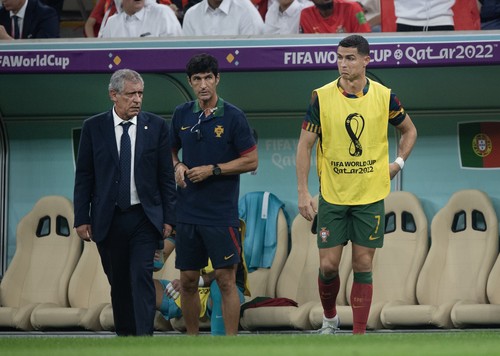 LUSAIL CITY, QATAR - DECEMBER 06: Portugal head coach Fernando Santos and substitute Cristiano Ronaldo during the FIFA World Cup Qatar 2022 Round of 16 match between Portugal and Switzerland at Lusail Stadium on December 6, 2022 in Lusail City, Qatar. (Photo by Visionhaus/Getty Images)