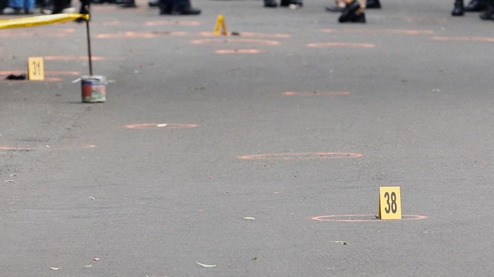 INDONESIA-BLAST/ Signs are placed around circled objects during investigation, following a blast at a district police station, that according to authorities was a suspected suicide bombing, in Bandung, West Java province, Indonesia, December 7, 2022. REUTERS/Willy Kurniawan