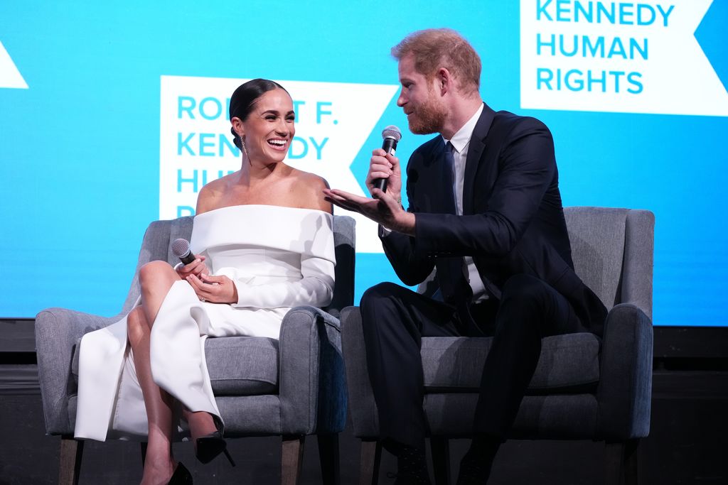 NEW YORK, NEW YORK - DECEMBER 06: Meghan, Duchess of Sussex and Prince Harry, Duke of Sussex speak onstage at the 2022 Robert F. Kennedy Human Rights Ripple of Hope Gala at New York Hilton on December 06, 2022 in New York City. (Photo by Kevin Mazur/Getty Images for 2022 Robert F. Kennedy Human Rights Ripple of Hope Gala)