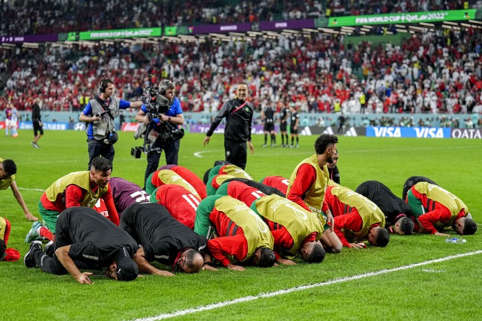 Moroccos players celebrate their victory over Spain during the World Cup round of 16 soccer match between Morocco and Spain, at the Education City Stadium in Al Rayyan, Qatar, Tuesday, Dec. 6, 2022. (AP Photo/Martin Meissner)
