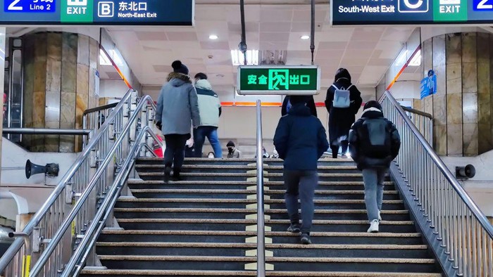 BEIJING, CHIAN - DECEMBER 5, 2022 - A light passenger flow is seen during the morning rush hour on Metro Line 5 in Beijing, China, December 5, 2022. On the same day, Beijing cancelled nucleic acid inspection on buses and subways. (Photo credit should read CFOTO/Future Publishing via Getty Images)