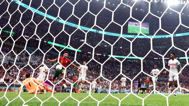 Soccer Football - FIFA World Cup Qatar 2022 - Round of 16 - Portugal v Switzerland - Lusail Stadium, Lusail, Qatar - December 6, 2022  Portugal's Goncalo Ramos scores their fifth goal to complete his hat-trick REUTERS/Hannah Mckay