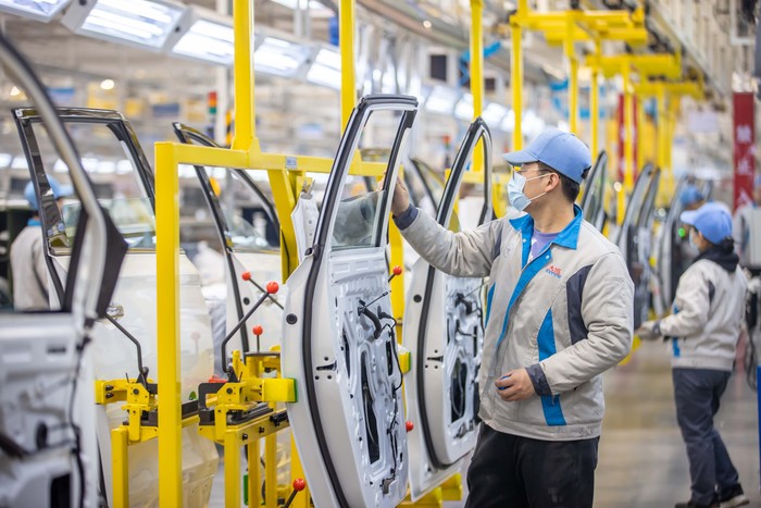 YUNCHENG, CHINA - DECEMBER 08: Employees work on the assembly line of electric vehicles at a factory of Dayun Automobile Co., Ltd on December 8, 2022 in Yuncheng, Shanxi Province of China. (Photo by VCG/VCG via Getty Images)