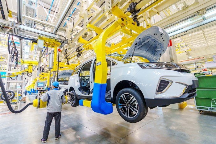 YUNCHENG, CHINA - DECEMBER 08: Employees work on the assembly line of electric vehicles at a factory of Dayun Automobile Co., Ltd on December 8, 2022 in Yuncheng, Shanxi Province of China. (Photo by VCG/VCG via Getty Images)