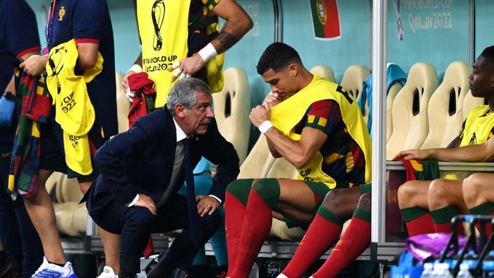LUSAIL CITY, QATAR - DECEMBER 06: Fernando Santos, Head Coach of Portugal, speaks with Cristiano Ronaldo before a substitution during the FIFA World Cup Qatar 2022 Round of 16 match between Portugal and Switzerland at Lusail Stadium on December 06, 2022 in Lusail City, Qatar. (Photo by Justin Setterfield/Getty Images)