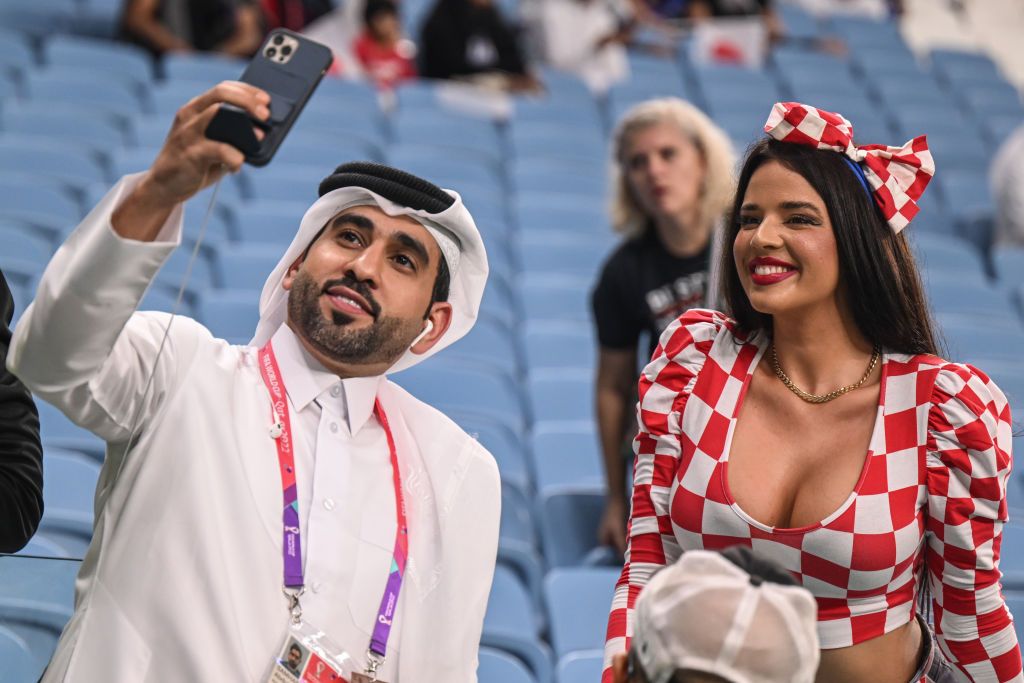 dpatop - 05 December 2022, Qatar, Al-Wakra: Soccer, World Cup, Japan - Croatia, final round, round of 16, Al-Janub Stadium, Ivana Knöll, a model from Croatia, poses in the stands before the match. Photo: Robert Michael/dpa (Photo by Robert Michael/picture alliance via Getty Images)