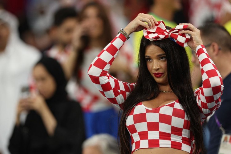 Croatia fan Ivana Knoll watches the Qatar 2022 World Cup round of 16 football match between Japan and Croatia at the Al-Janoub Stadium in Al-Wakrah, south of Doha on December 5, 2022. (Photo by Adrian DENNIS / AFP) (Photo by ADRIAN DENNIS/AFP via Getty Images)