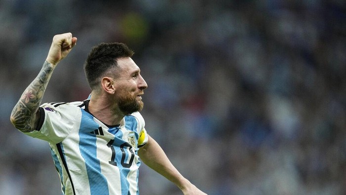 Argentinas Lionel Messi celebrates at the end of the World Cup quarterfinal soccer match between the Netherlands and Argentina, at the Lusail Stadium in Lusail, Qatar, Saturday, Dec. 10, 2022. Argentina defeated the Netherlands 4-3 in a penalty shootout after the match ended tied 2-2.(AP Photo/Jorge Saenz)