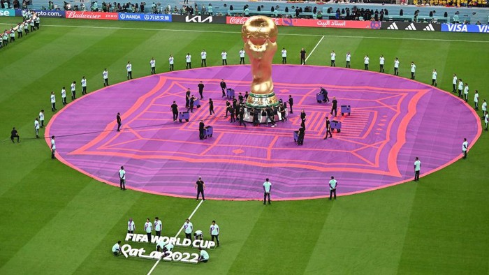AL KHOR, QATAR - NOVEMBER 20: FIFA World Cup trophy replica displayed on the pitch during the official opening ceremony of FIFA World Cup Qatar 2022 ahead of the opening match between Qatar and Ecuador at Al Bayt Stadium in Al Khor City, Qatar on November 20, 2022. (Photo by Mustafa Yalcin/Anadolu Agency via Getty Images)